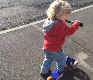 Callum age 2 on his scooter